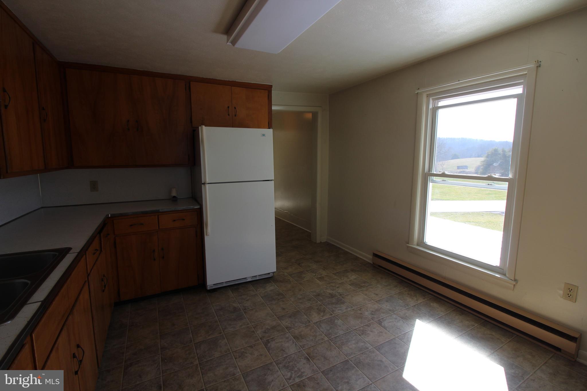 18947 Senedo Road, Unit 4 Edinburg, VA 22824 - Photo 5 of 15 a utility room with closet dryer and washer