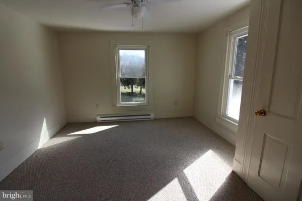 a view of an empty room with a window