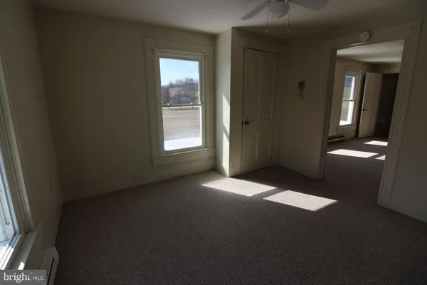 an empty room with windows