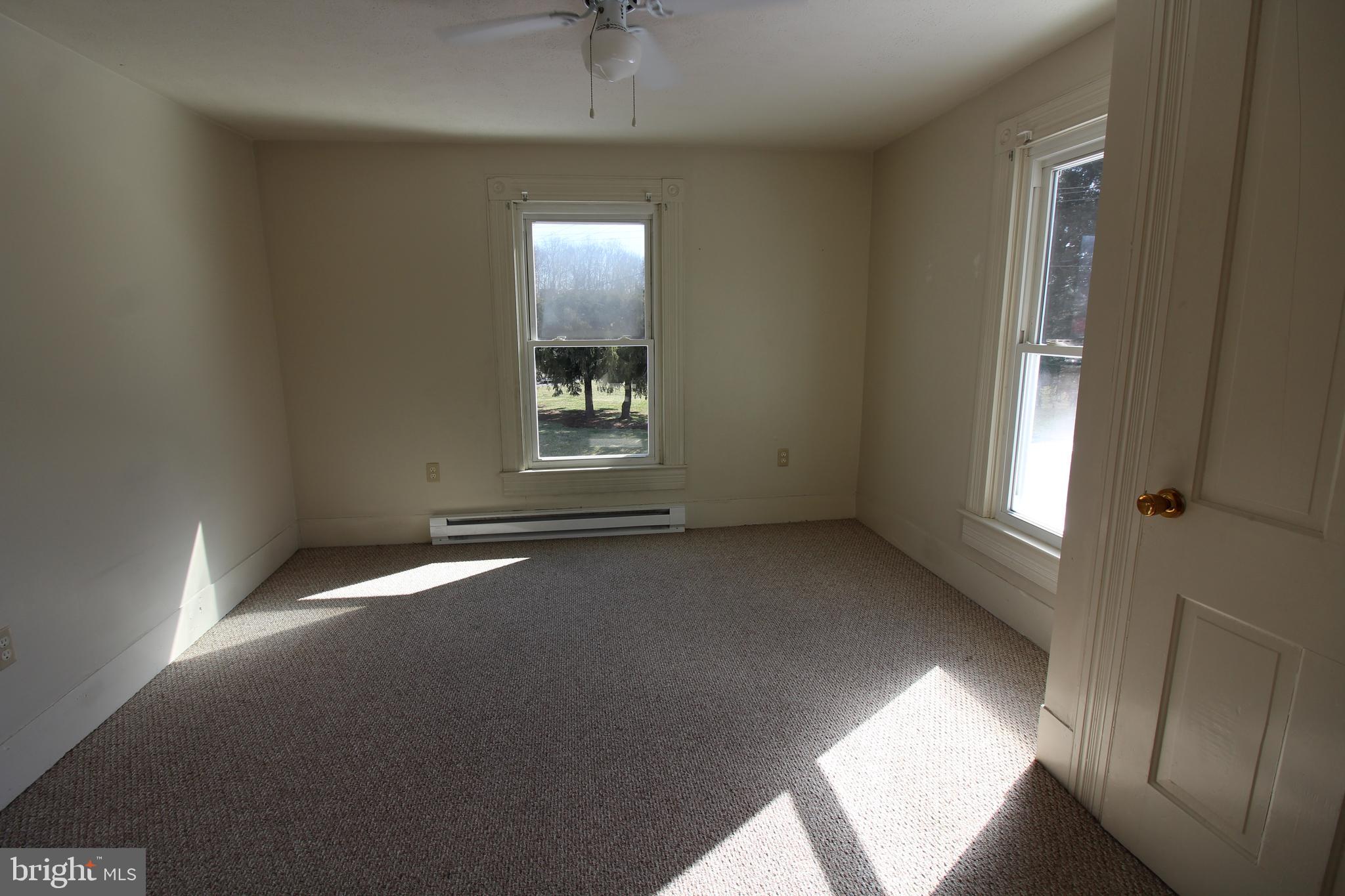 18947 Senedo Road, Unit 4 Edinburg, VA 22824 - Photo 7 of 15 a view of an empty room with a window