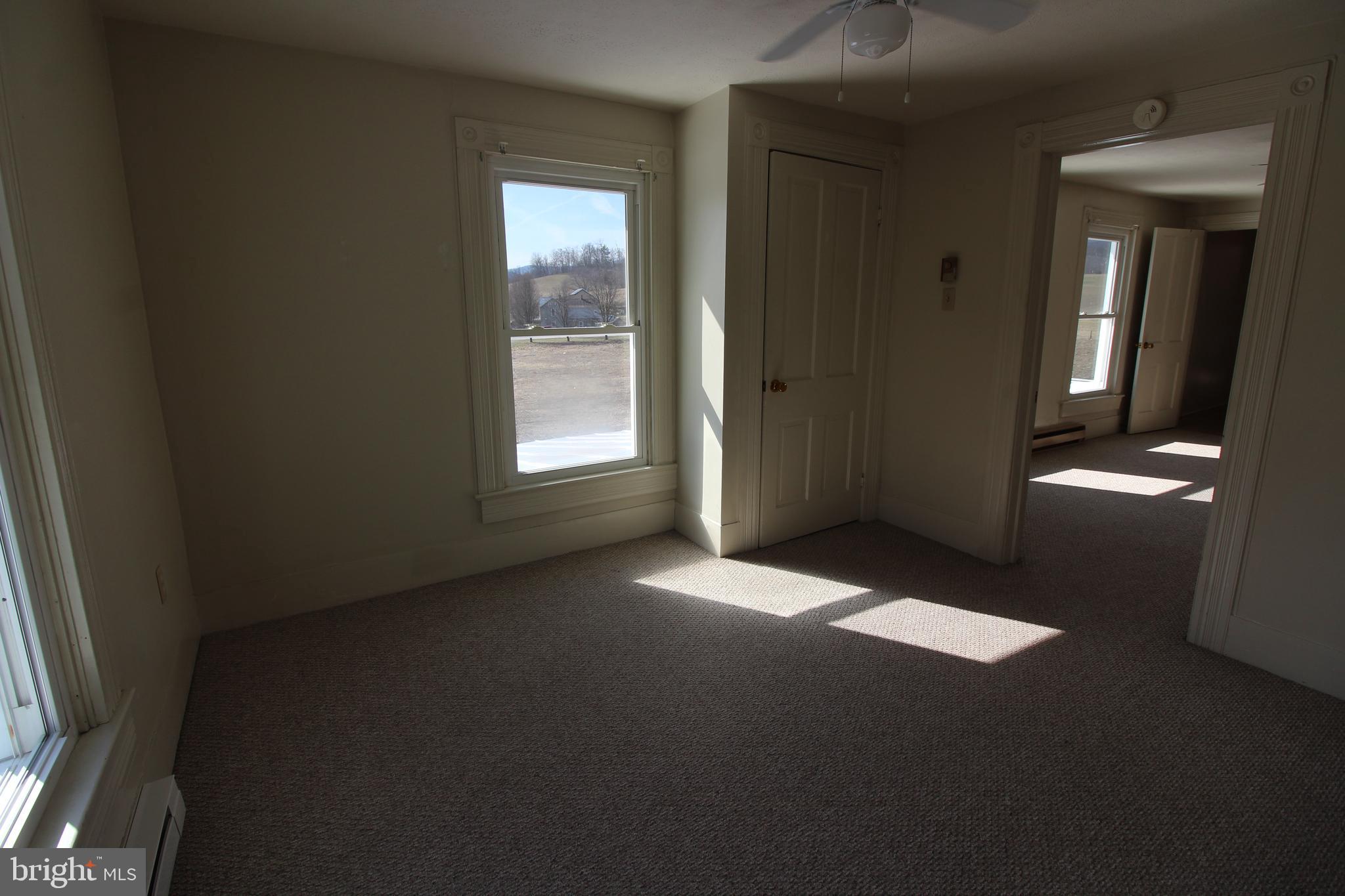 18947 Senedo Road, Unit 4 Edinburg, VA 22824 - Photo 8 of 15 an empty room with windows