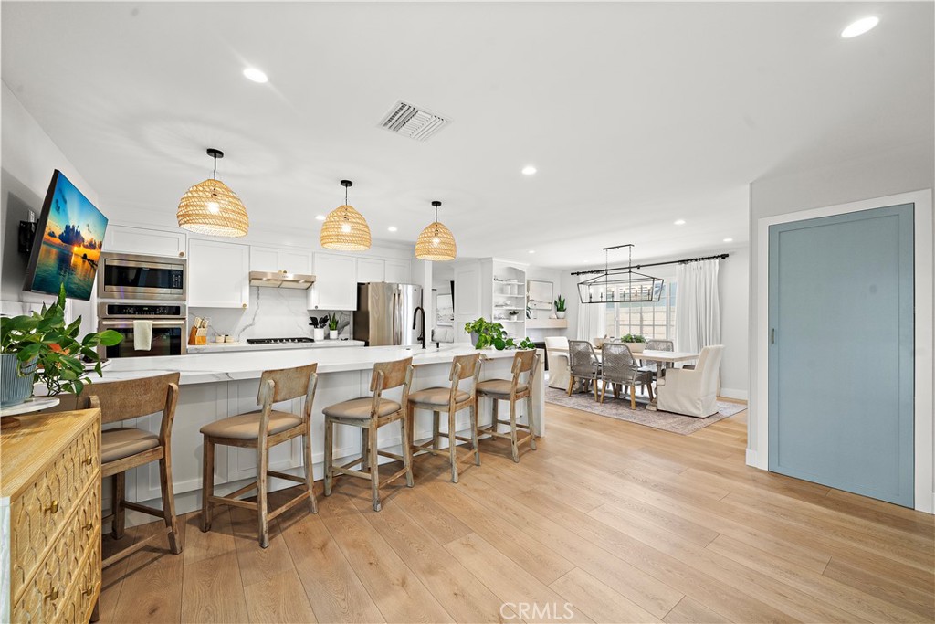 8741 La Roca Avenue Fountain Valley, CA 92708 - Photo 19 of 50 Family room, kitchen, and dining room