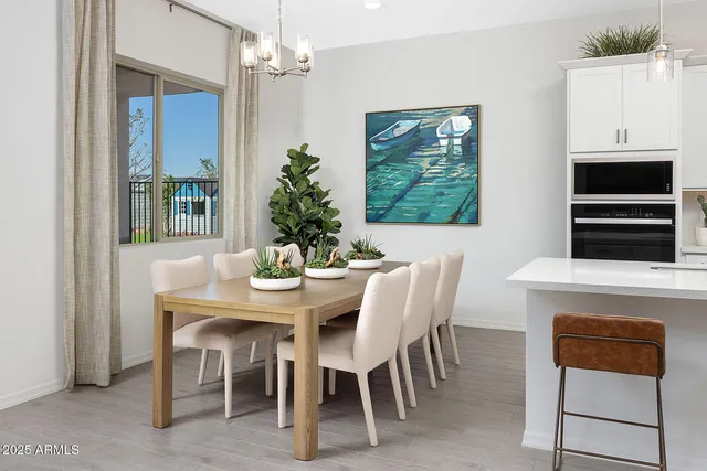 a dining room with furniture and window