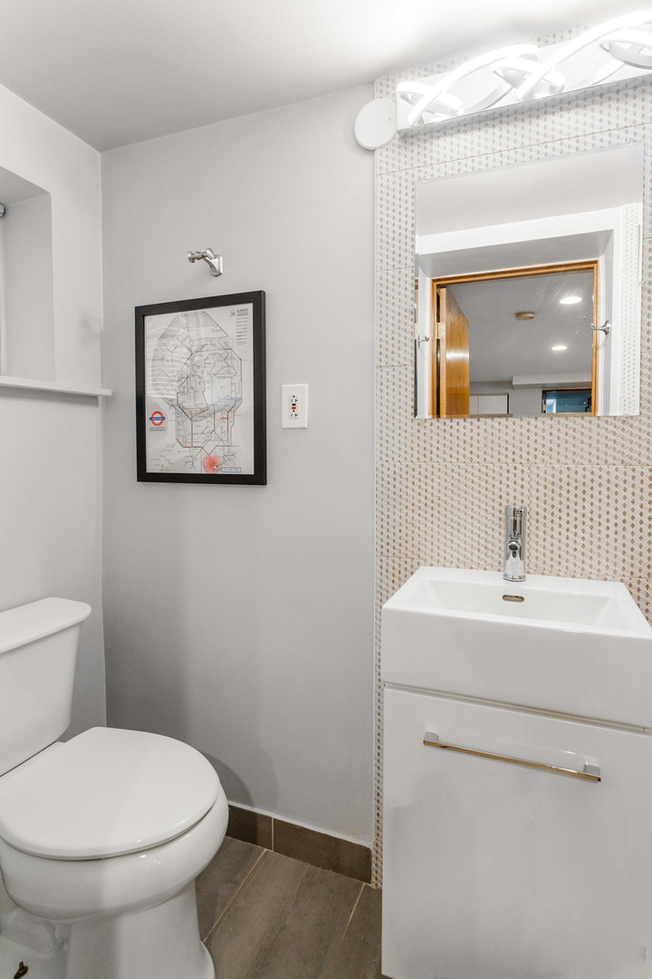 3201 Park Avenue Brookfield, IL 60513 - Photo 17 of 22 a bathroom with a toilet sink and mirror