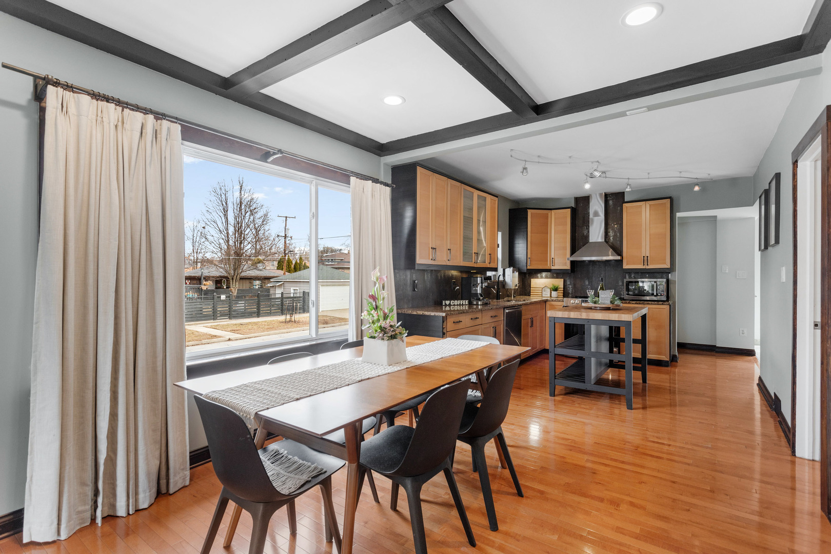 3201 Park Avenue Brookfield, IL 60513 - Photo 4 of 22 a dining room with stainless steel appliances granite countertop furniture wooden floor and a rug