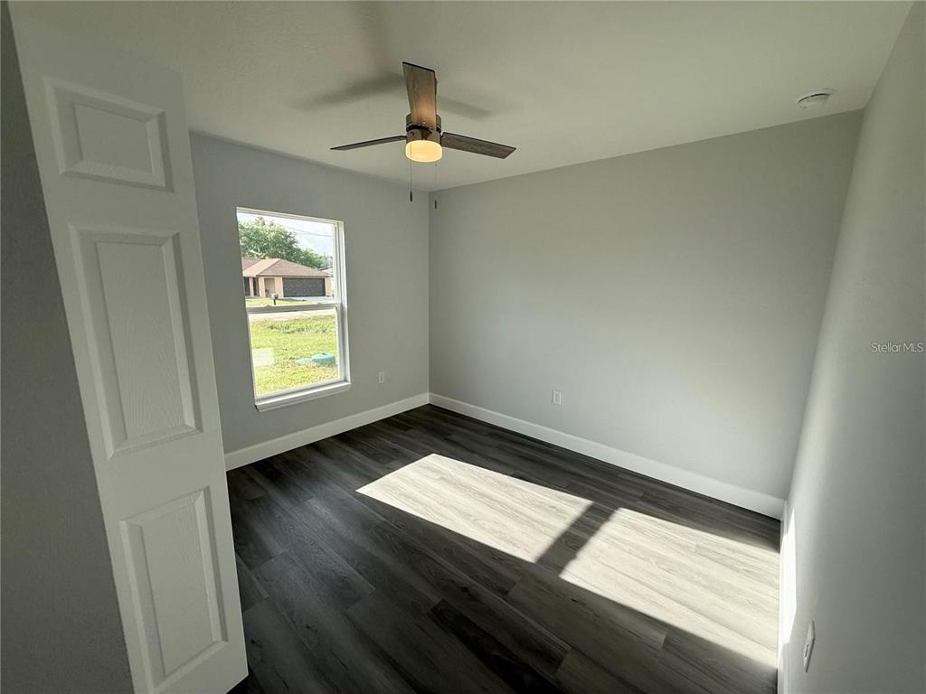 3577 Southwest 149th Terrace Ocala, FL 34481 - Photo 23 of 31 a view of wooden floor and windows in an empty room