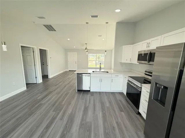 a view of a house with a yard