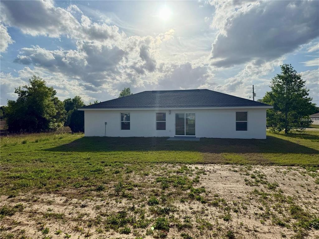 3577 Southwest 149th Terrace Ocala, FL 34481 - Photo 31 of 31 a view of a house with a yard