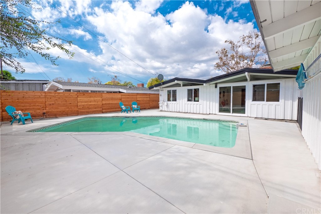 3316 North Studebaker Road Long Beach, CA 90808 - Photo 20 of 29 a house with green field in front of it