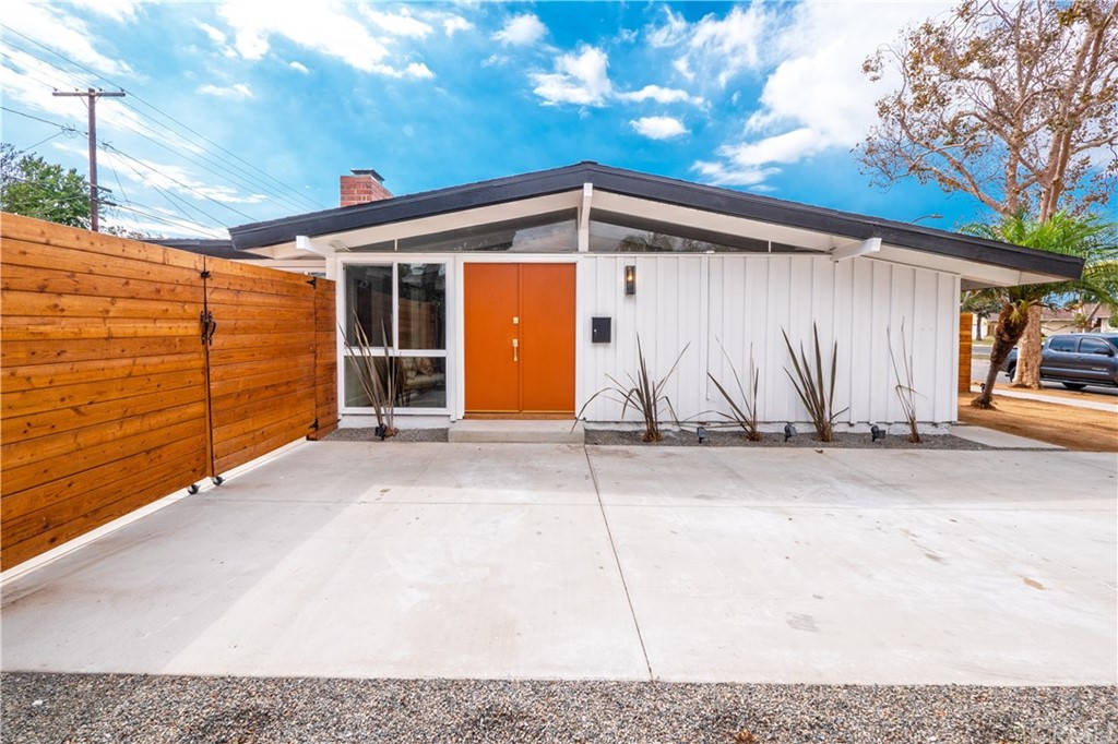 3316 North Studebaker Road Long Beach, CA 90808 - Photo 2 of 29 a backyard of a house with garage and wooden fence