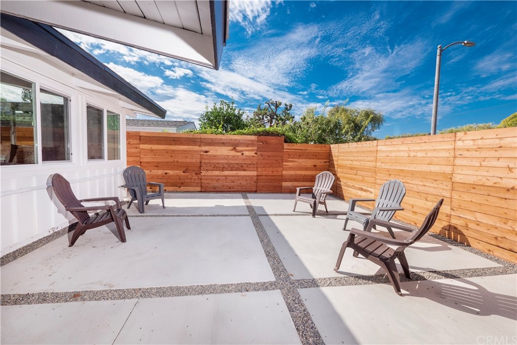 3316 North Studebaker Road Long Beach, CA 90808 - Photo 23 of 29 a building outdoor space with patio furniture and a fireplace