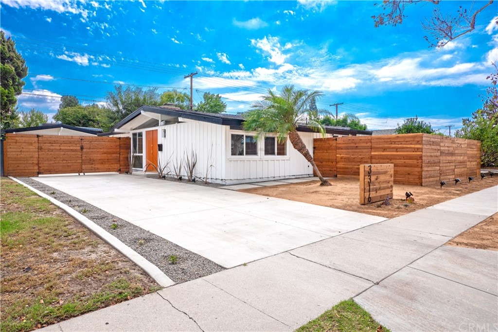 3316 North Studebaker Road Long Beach, CA 90808 - Photo 25 of 29 a view of a house with a backyard