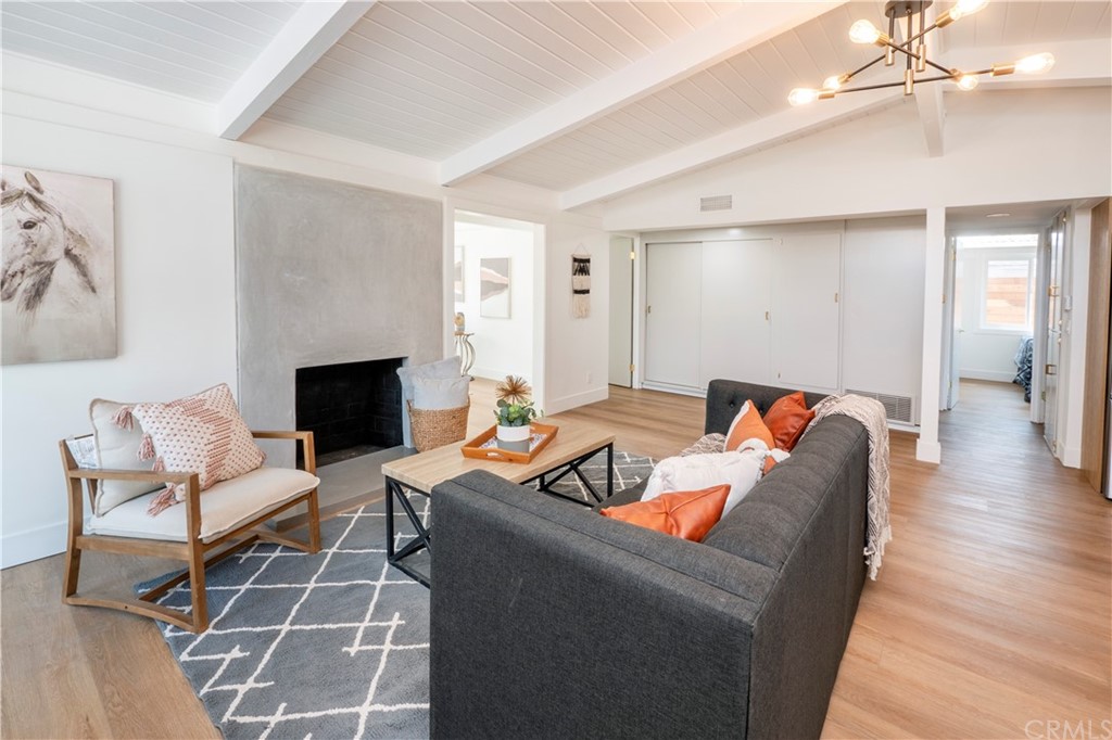 3316 North Studebaker Road Long Beach, CA 90808 - Photo 4 of 29 a living room with furniture and a fireplace