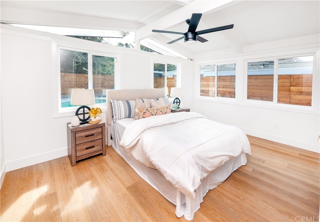 3316 North Studebaker Road Long Beach, CA 90808 - Photo 8 of 29 a spacious bedroom with a bed and wooden floor