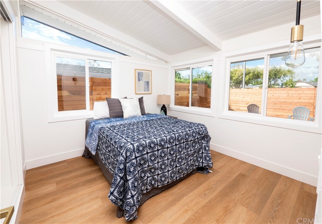 3316 North Studebaker Road Long Beach, CA 90808 - Photo 10 of 29 a bedroom with a large bed and a large window