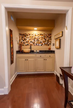 a kitchen with stainless steel appliances granite countertop a sink and cabinets