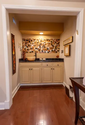 a kitchen with stainless steel appliances granite countertop a sink and cabinets