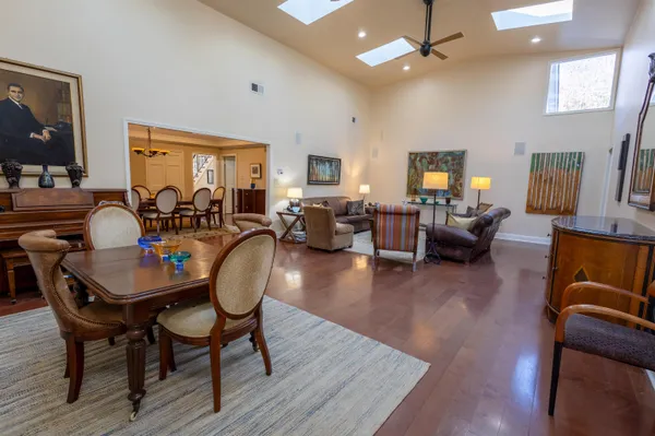 a living room with fireplace furniture and a wooden floor