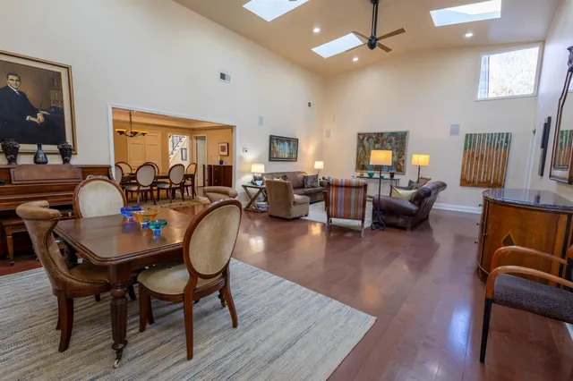 a living room with fireplace furniture and a wooden floor