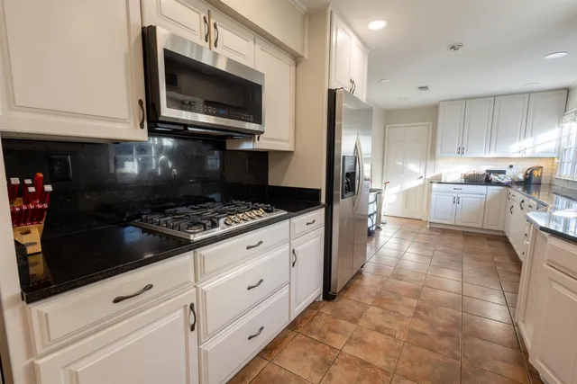 a kitchen with a stove and a microwave