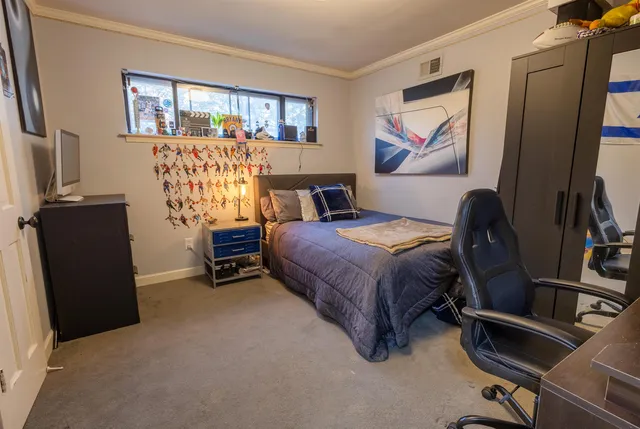 a bedroom with a bed and furniture