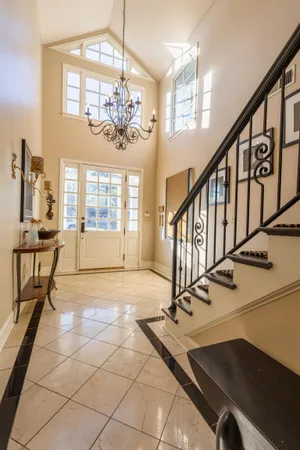 a view of a livingroom with furniture and a window