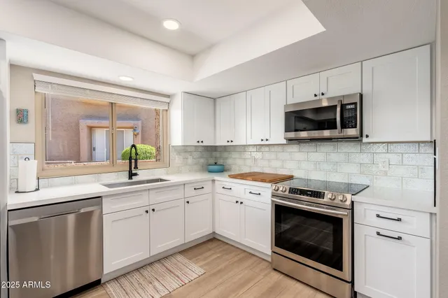 a bathroom with a sink and a shower
