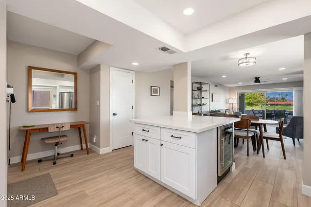 a kitchen with stainless steel appliances a refrigerator sink and stove