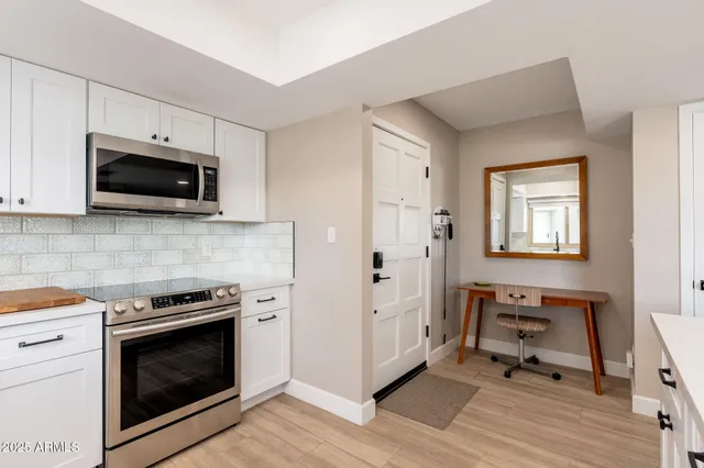 a kitchen with a sink stove and refrigerator