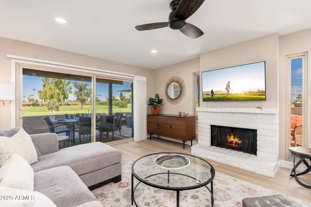 a living room with furniture and a fireplace