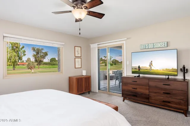 a bathroom with a granite countertop toilet sink and shower