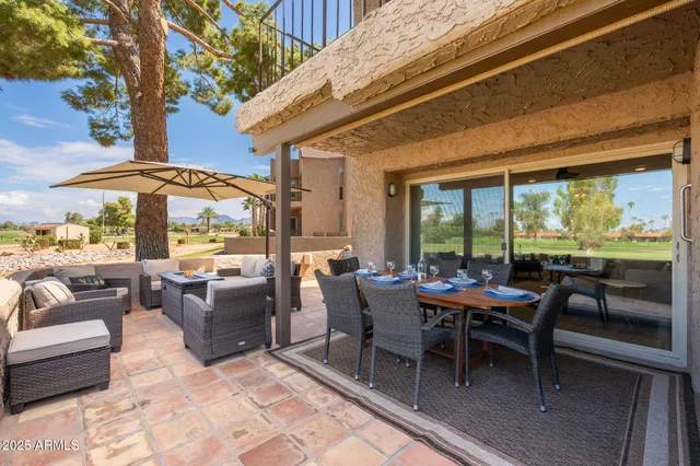 a outdoor space with patio the couches and dining table with a garden view