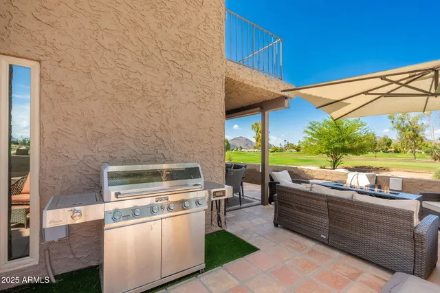 a swimming pool with outdoor seating and yard