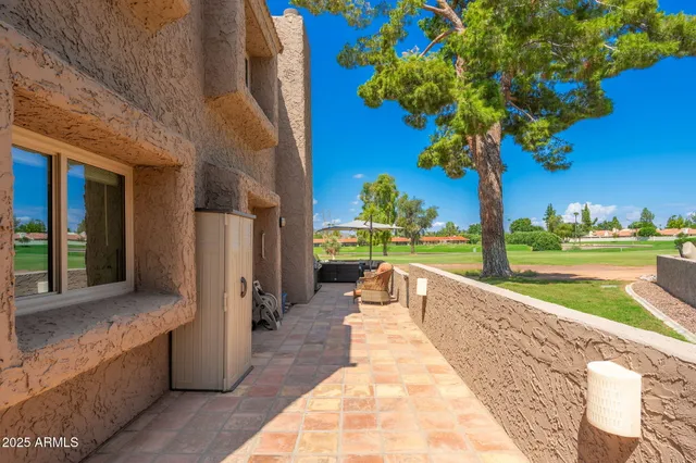 a view of a swimming pool with a lounge chairs