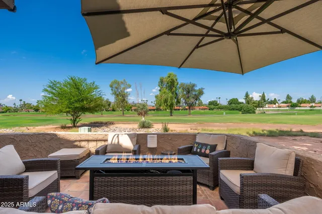 a view of swimming pool with outdoor seating