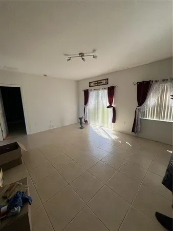 a view of an empty room with a fireplace