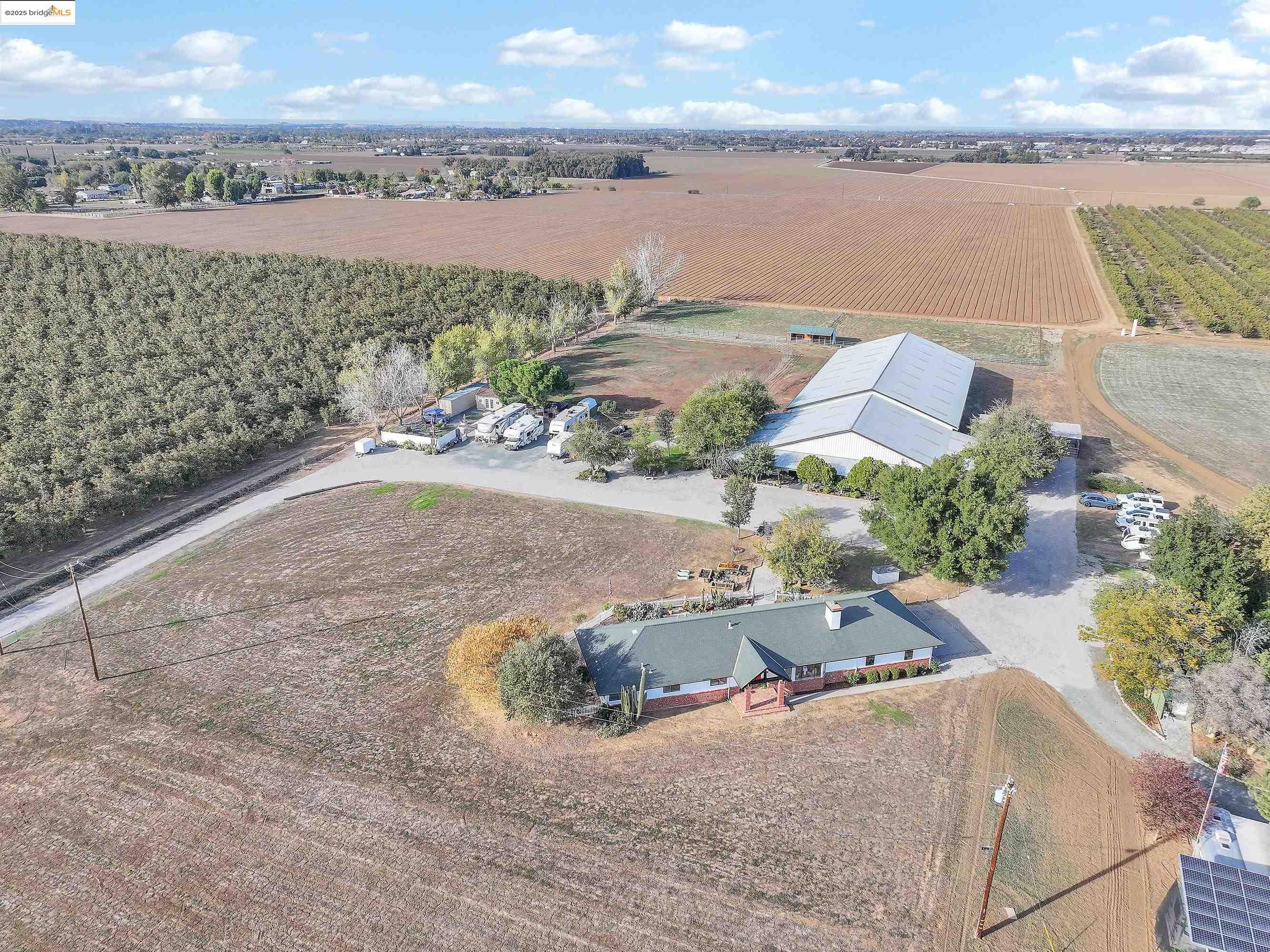 an aerial view of a house with a lake view