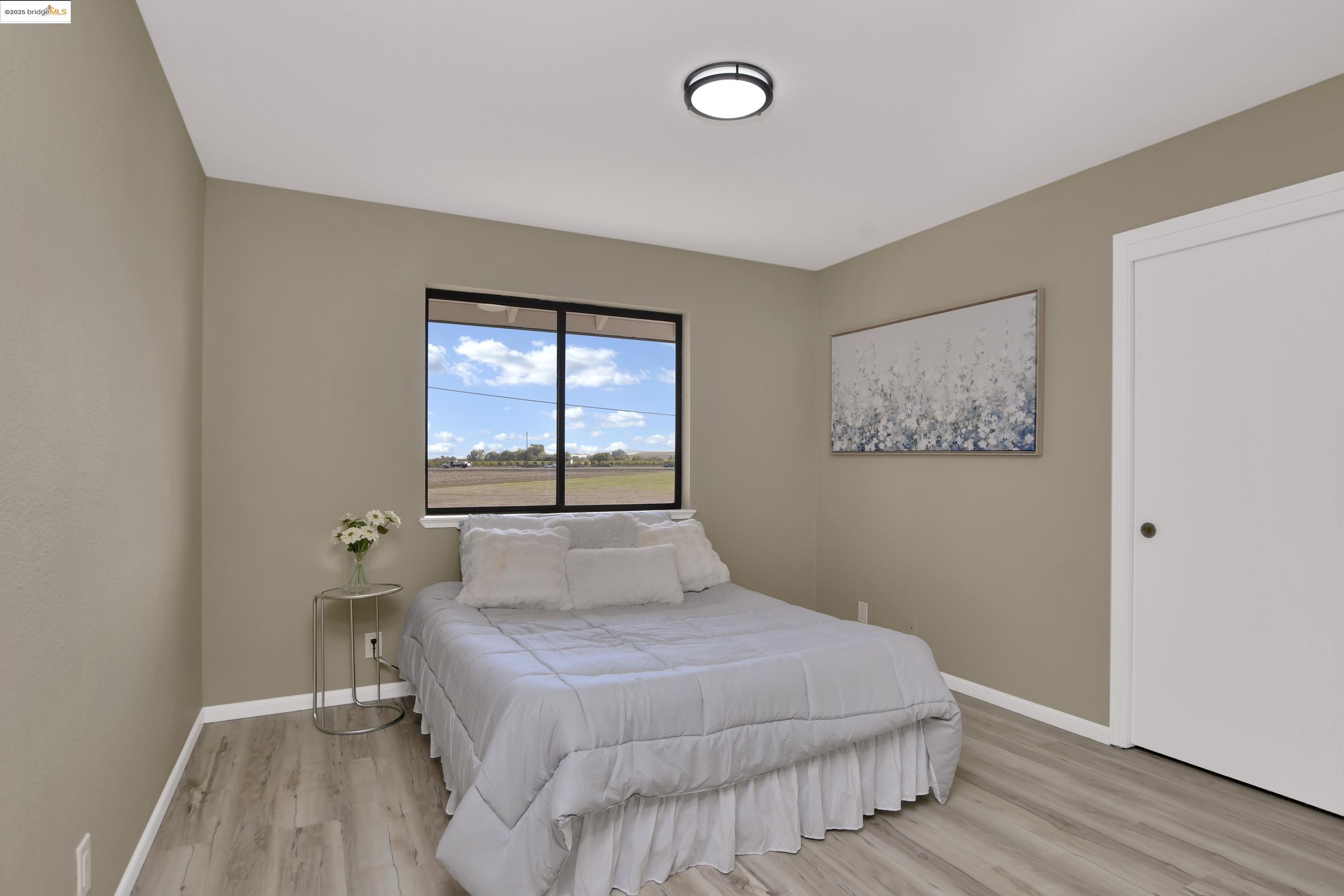 23701 Marsh Creek Road Brentwood, CA 94513 - Photo 12 of 52 a bedroom with a bed and a window