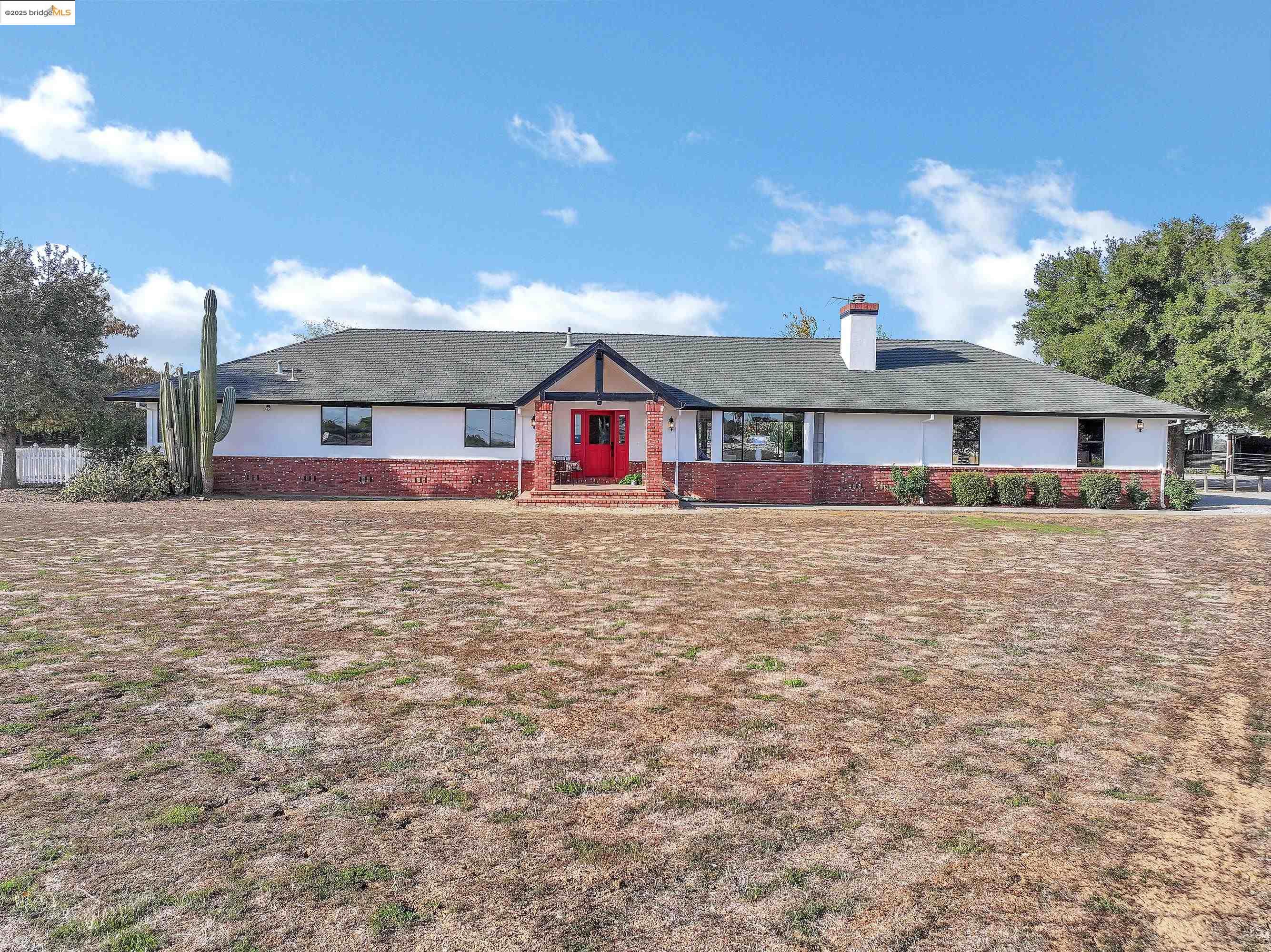 23701 Marsh Creek Road Brentwood, CA 94513 - Photo 2 of 52 a large house with a big yard and large trees