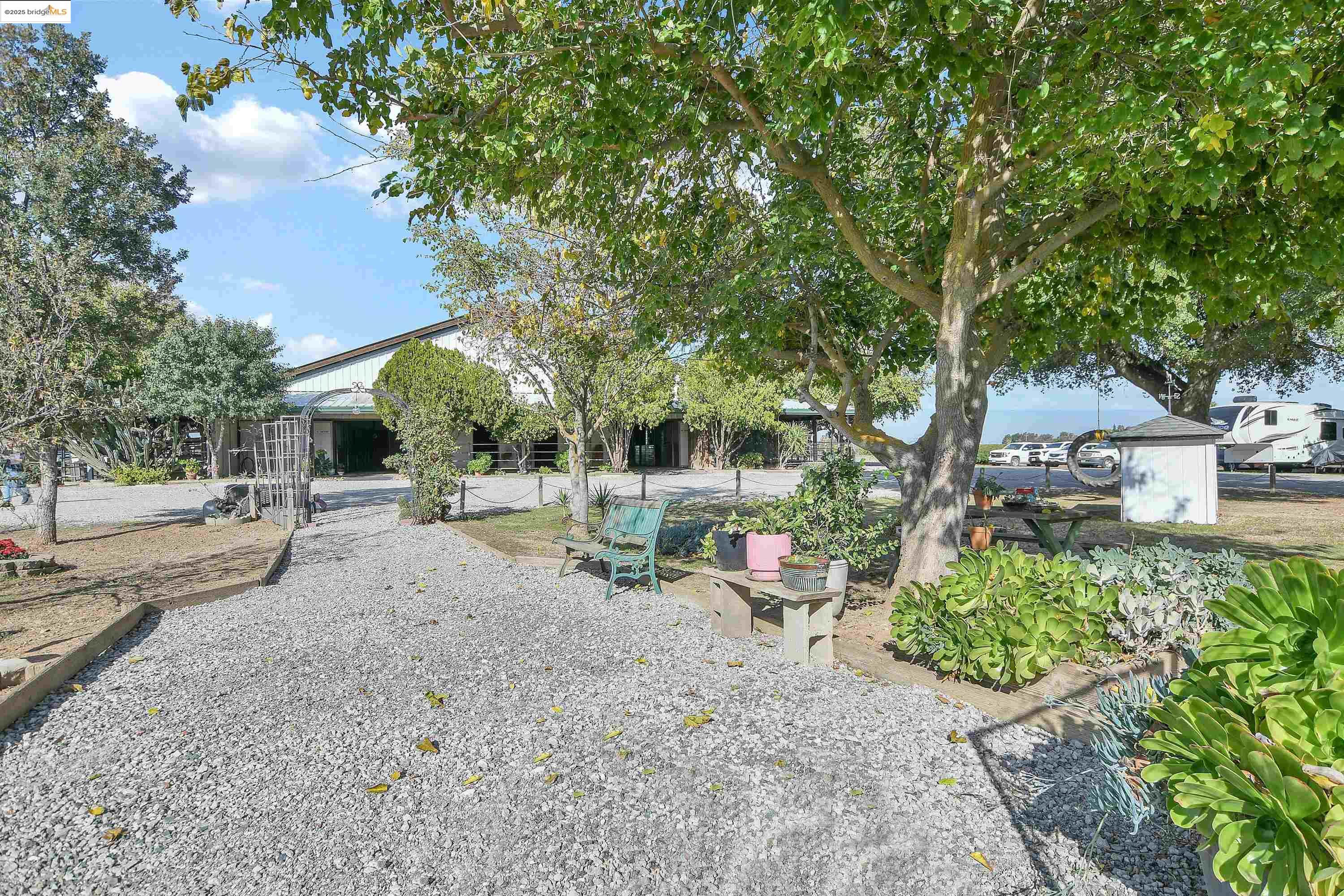 23701 Marsh Creek Road Brentwood, CA 94513 - Photo 21 of 52 a backyard of a house with table and chairs