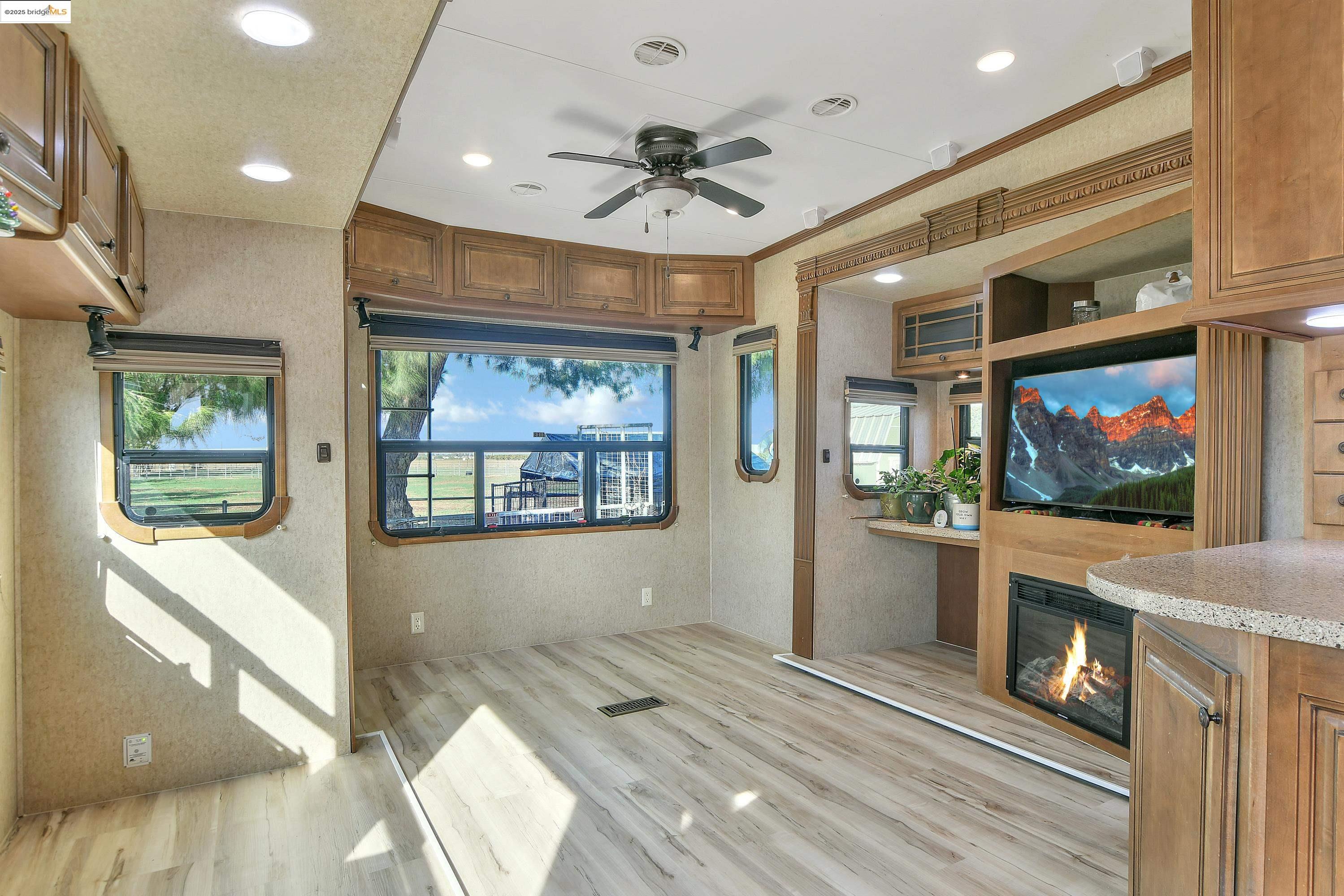 23701 Marsh Creek Road Brentwood, CA 94513 - Photo 28 of 52 a view of an empty room with a fireplace and a window