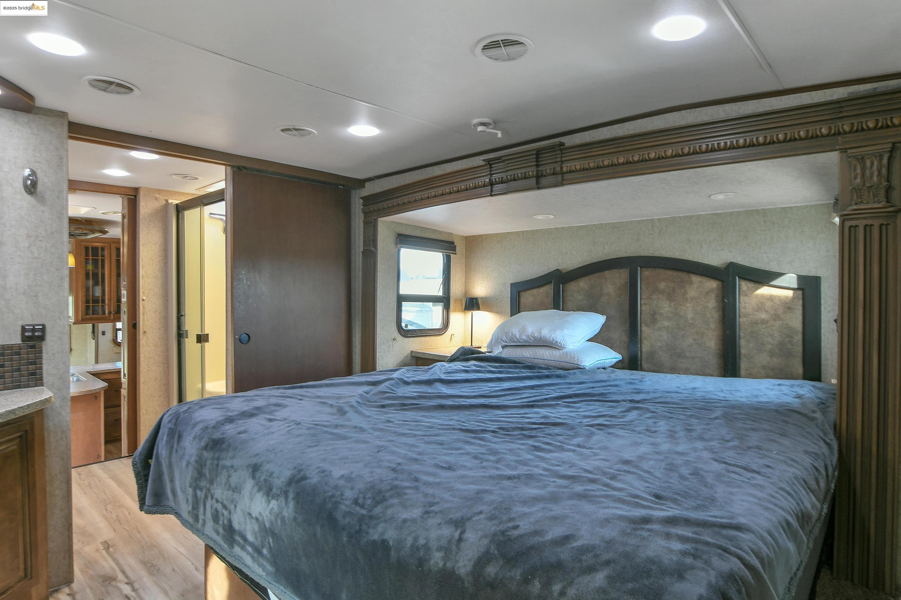 23701 Marsh Creek Road Brentwood, CA 94513 - Photo 31 of 52 a large bed sitting in a bedroom next to a balcony