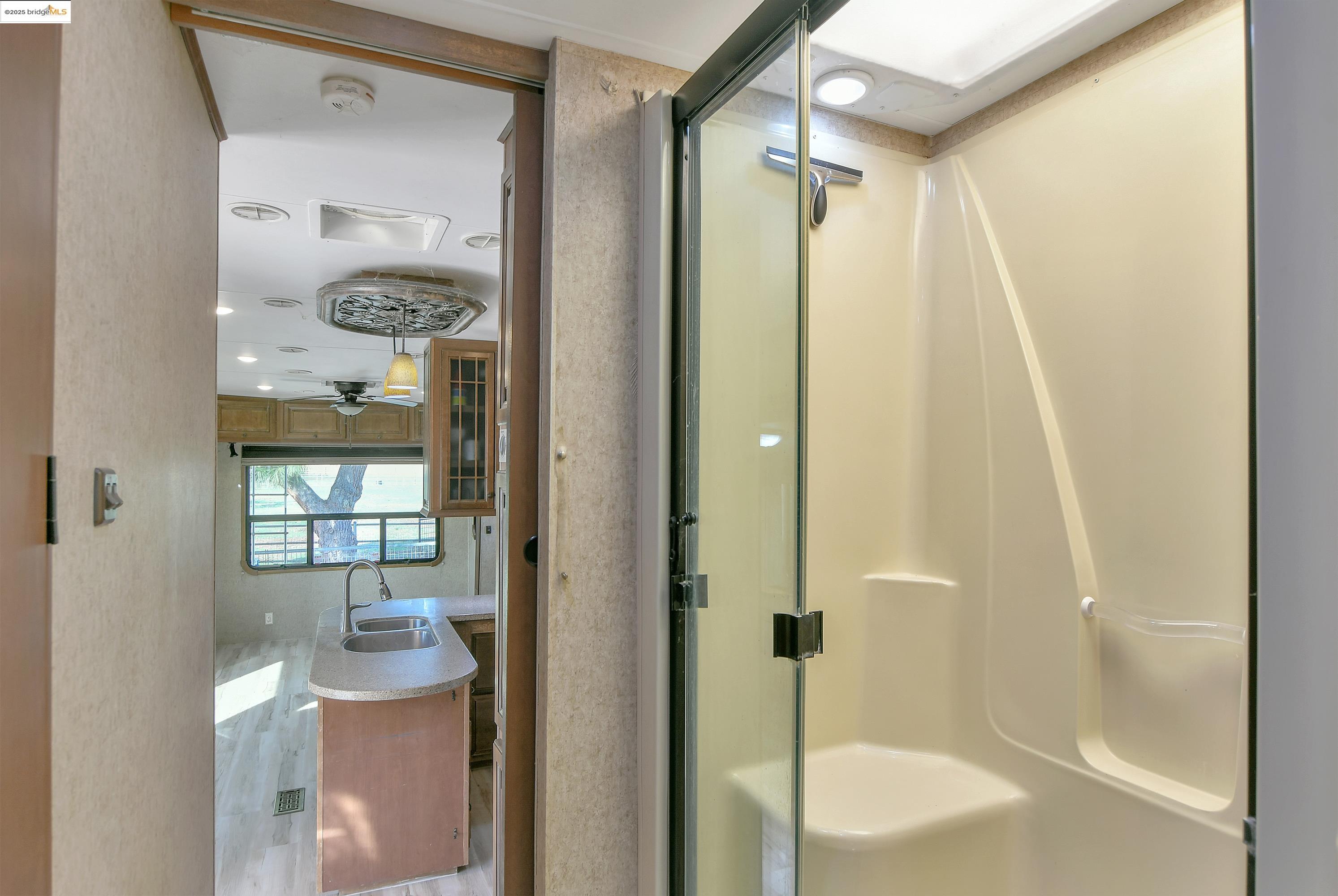 23701 Marsh Creek Road Brentwood, CA 94513 - Photo 32 of 52 a bathroom with a bathtub and a shower