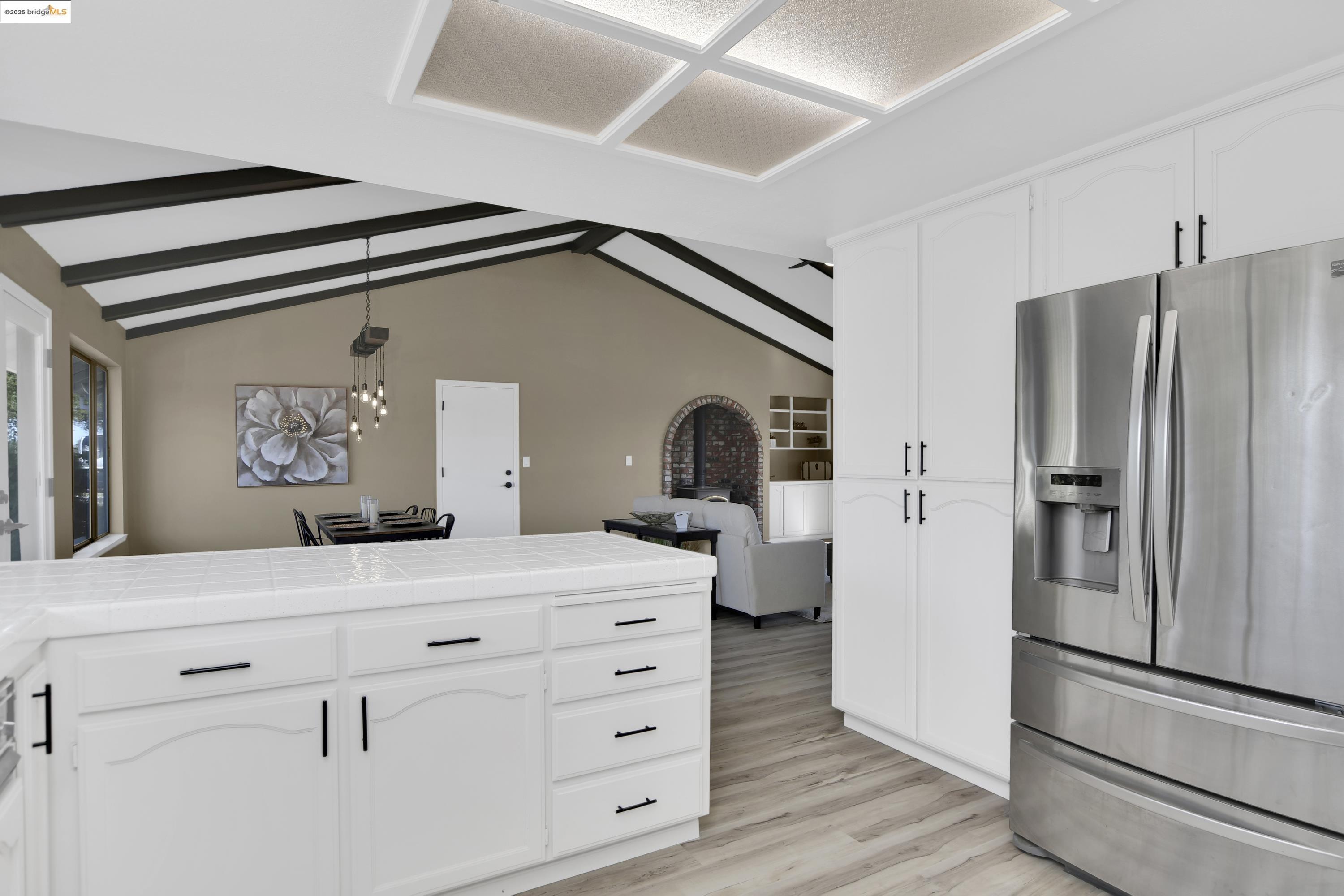 23701 Marsh Creek Road Brentwood, CA 94513 - Photo 10 of 52 a kitchen with a refrigerator and countertop