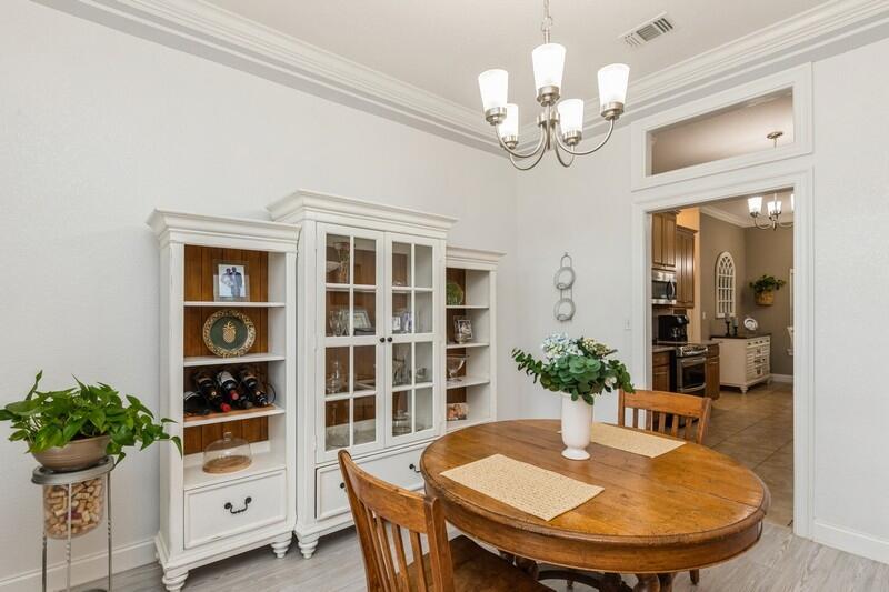 2903 Chancery Lane Crestview, FL 32539 - Photo 11 of 43 a view of a dining room with furniture and chandelier