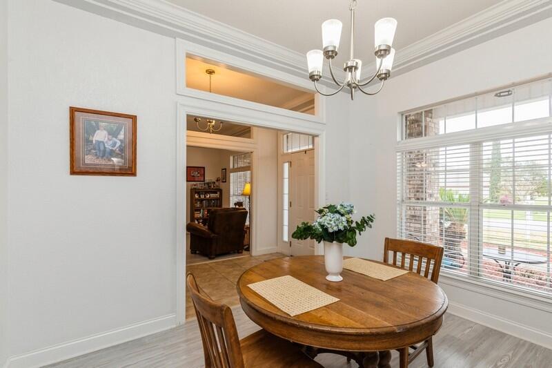 2903 Chancery Lane Crestview, FL 32539 - Photo 12 of 43 a view of a dining room with furniture window and outside view
