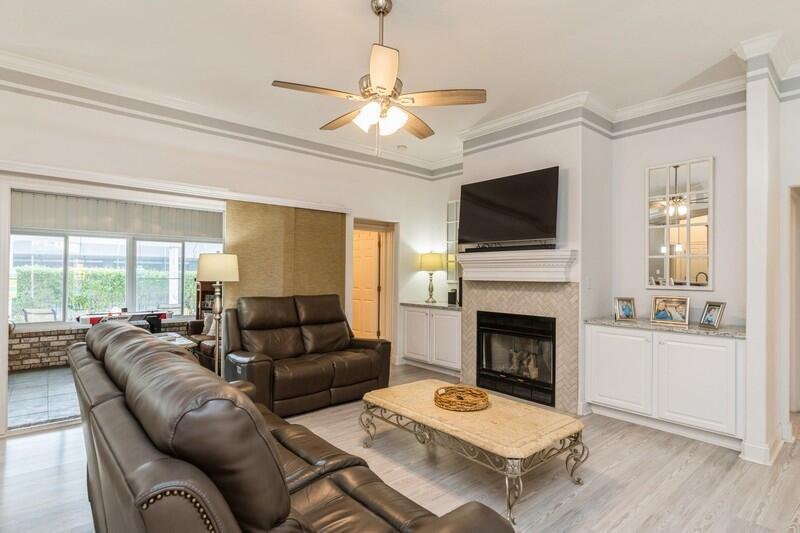 2903 Chancery Lane Crestview, FL 32539 - Photo 13 of 43 a living room with furniture a fireplace and a flat screen tv