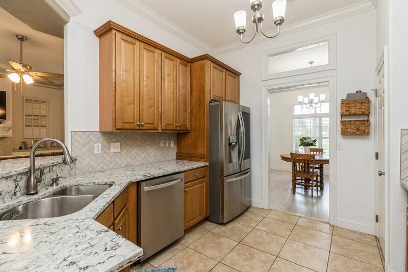 2903 Chancery Lane Crestview, FL 32539 - Photo 17 of 43 a kitchen with stainless steel appliances granite countertop a refrigerator and a sink