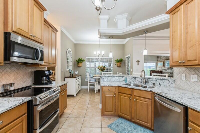 2903 Chancery Lane Crestview, FL 32539 - Photo 18 of 43 a kitchen with a sink cabinets stainless steel appliances and a window
