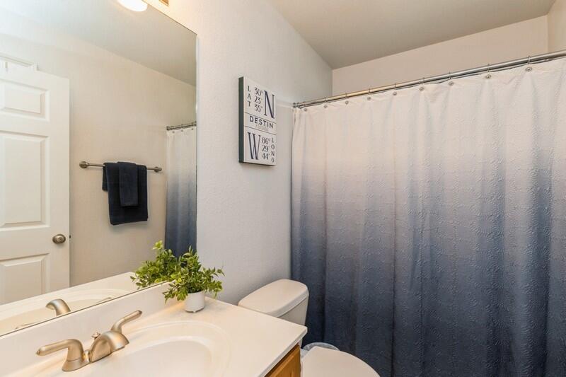 2903 Chancery Lane Crestview, FL 32539 - Photo 26 of 43 a bathroom with a sink mirror and a toilet